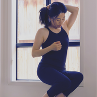 Elva Ribbed Tank in Black – sleek high-neck tank with built-in bra, ultra-stretch fit, and breathable fabric. Perfect for workouts and everyday wear.