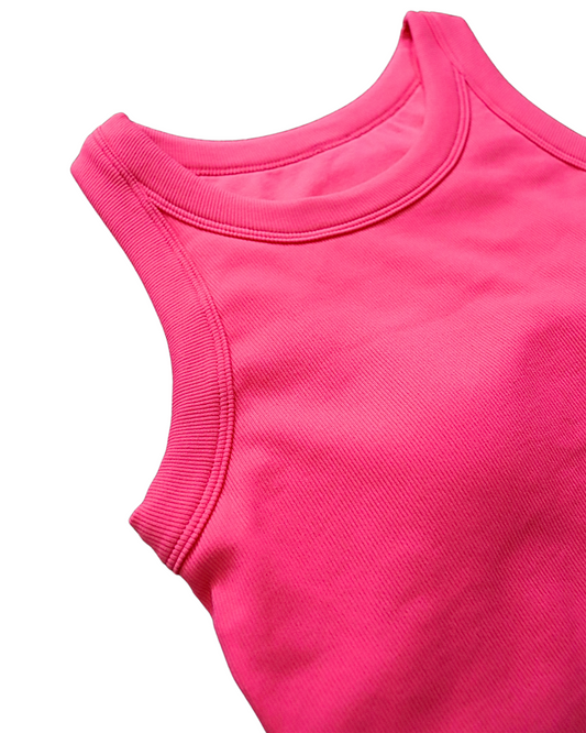Cropped ribbed sports tank with built-in bra in pink and blue. Breathable, stretchy, and form-fitting for workouts or everyday wear.
