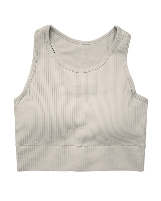 Tessa Ribbed Bra – ultra-stretch, seamless ribbed sports bra with light compression, breathable fabric, and a sculpted fit. Perfect for yoga, gym workouts, and athleisure styling.
