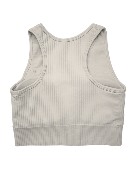Tessa Ribbed Bra – ultra-stretch, seamless ribbed sports bra with light compression, breathable fabric, and a sculpted fit. Perfect for yoga, gym workouts, and athleisure styling.