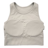Tessa Ribbed Bra – ultra-stretch, seamless ribbed sports bra with light compression, breathable fabric, and a sculpted fit. Perfect for yoga, gym workouts, and athleisure styling.