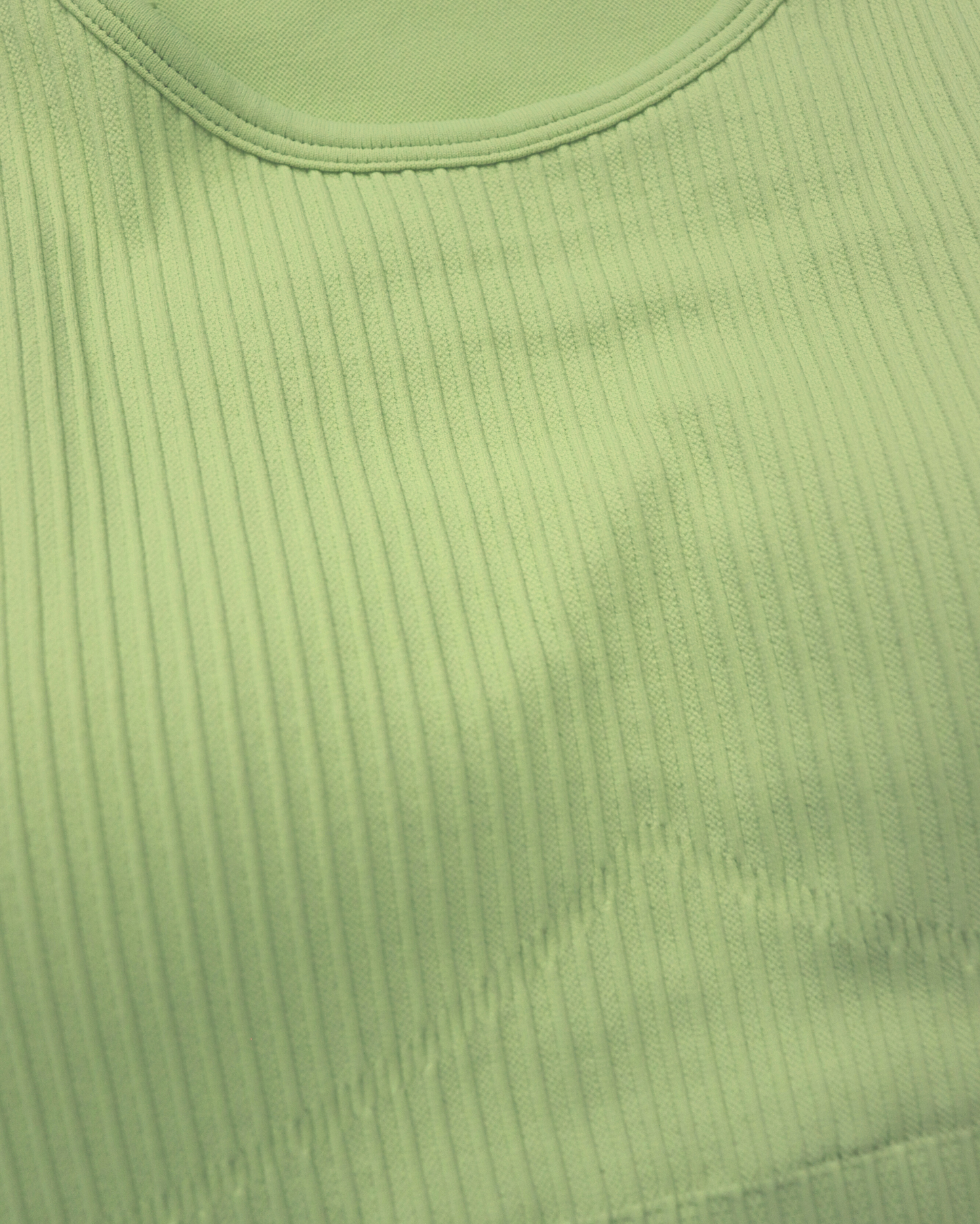 Tessa Ribbed Bra – ultra-stretch, seamless ribbed sports bra with light compression, breathable fabric, and a sculpted fit. Perfect for yoga, gym workouts, and athleisure styling.